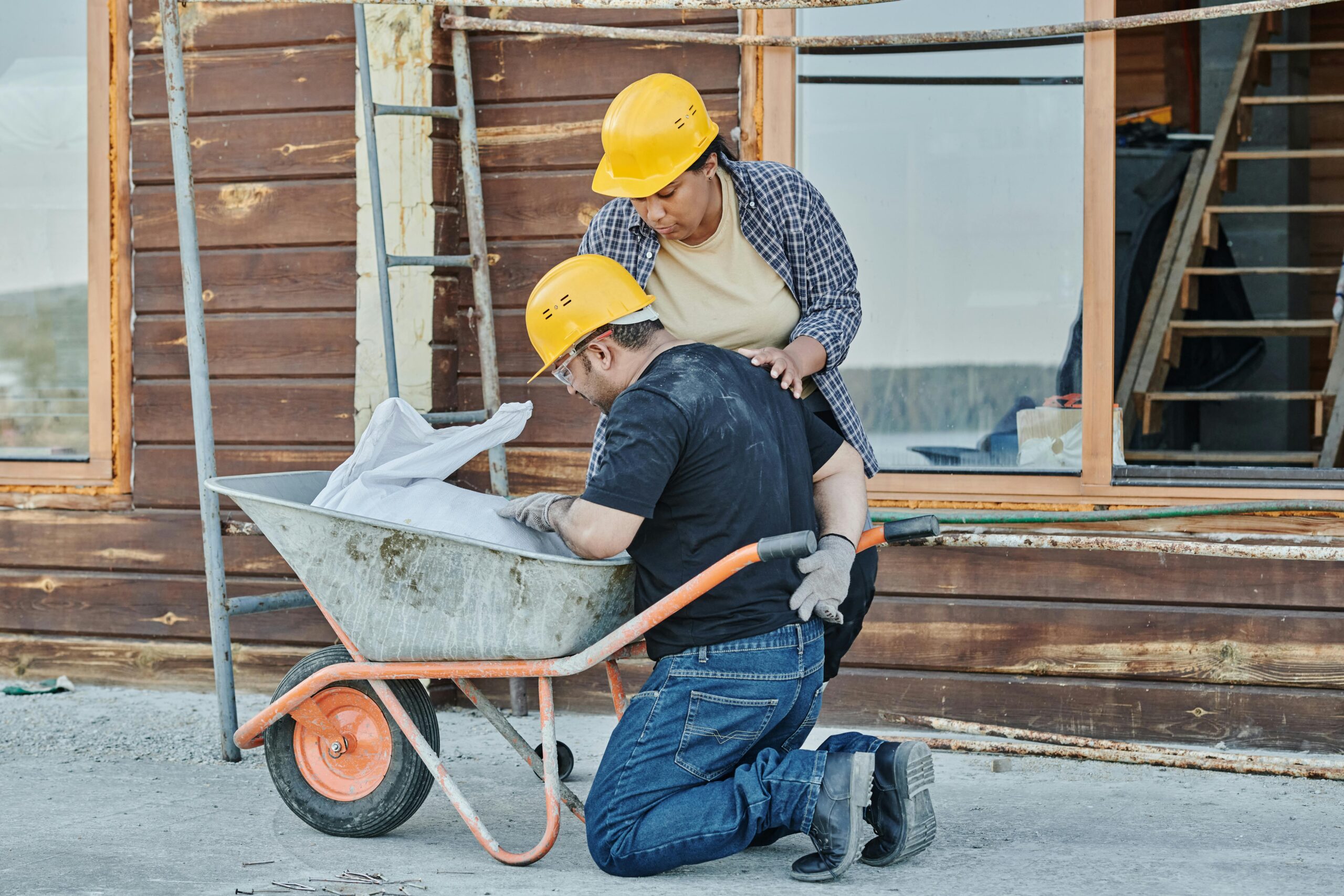 Injured Worker near wheel barrow